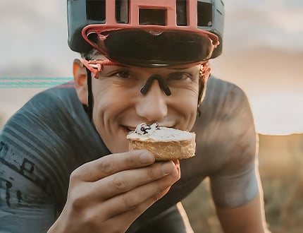 Cyclist eating cake